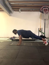 a man doing push ups in a gym